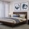 large, carpeted bedroom with oversized window
