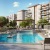 rendering of outdoor swimming pool surrounded by lounge chairs