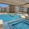 Resort-style swimming pool with lounge seating